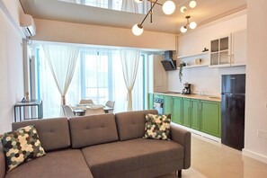 Exclusief appartement | Woonruimte | Een flatscreentelevisie