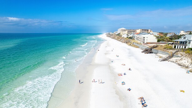 A beach with white sand and clear turquoise water. There are buildings along the shore and people on the beach. - Blue Mountain "Drift Away" | 4BR | Pool Access | 2 BIkes (Santa Rosa Beach)