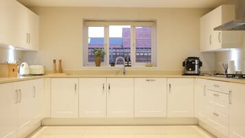 Villa | Private kitchen | Fridge, microwave, oven, stovetop