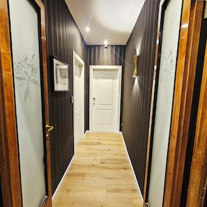 Luxury Suite, Courtyard View | Living area | TV