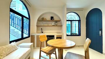 Standard Apartment, 1 Bedroom, Private Bathroom | Living area | 49-inch TV with digital channels