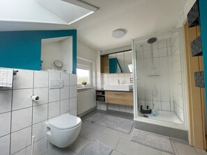 Shower, hair dryer, towels, soap