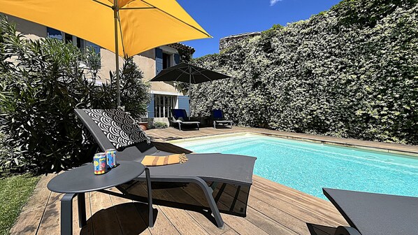 Seasonal outdoor pool, pool umbrellas, pool loungers