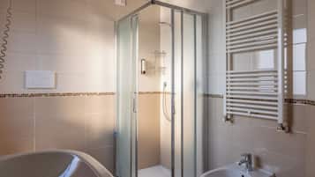 Shower, hair dryer, towels, soap