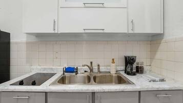 Fridge, microwave, stovetop, coffee/tea maker