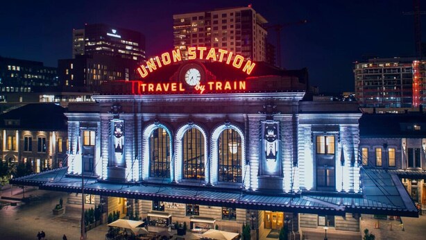 Union Station with a prominent clock and illuminated signage.