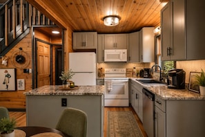 Coffee/tea maker, fridge, microwave, oven