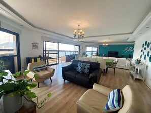 Apartment | Living area - Apê Praia das Astúrias Vista Mar (Guarujá)