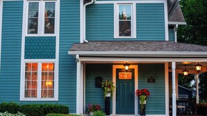 A two-story house with a green front door, a mailbox, and a number plate. - Downtown St. Charles: Walk to Bars & Restaurants (St. Charles)