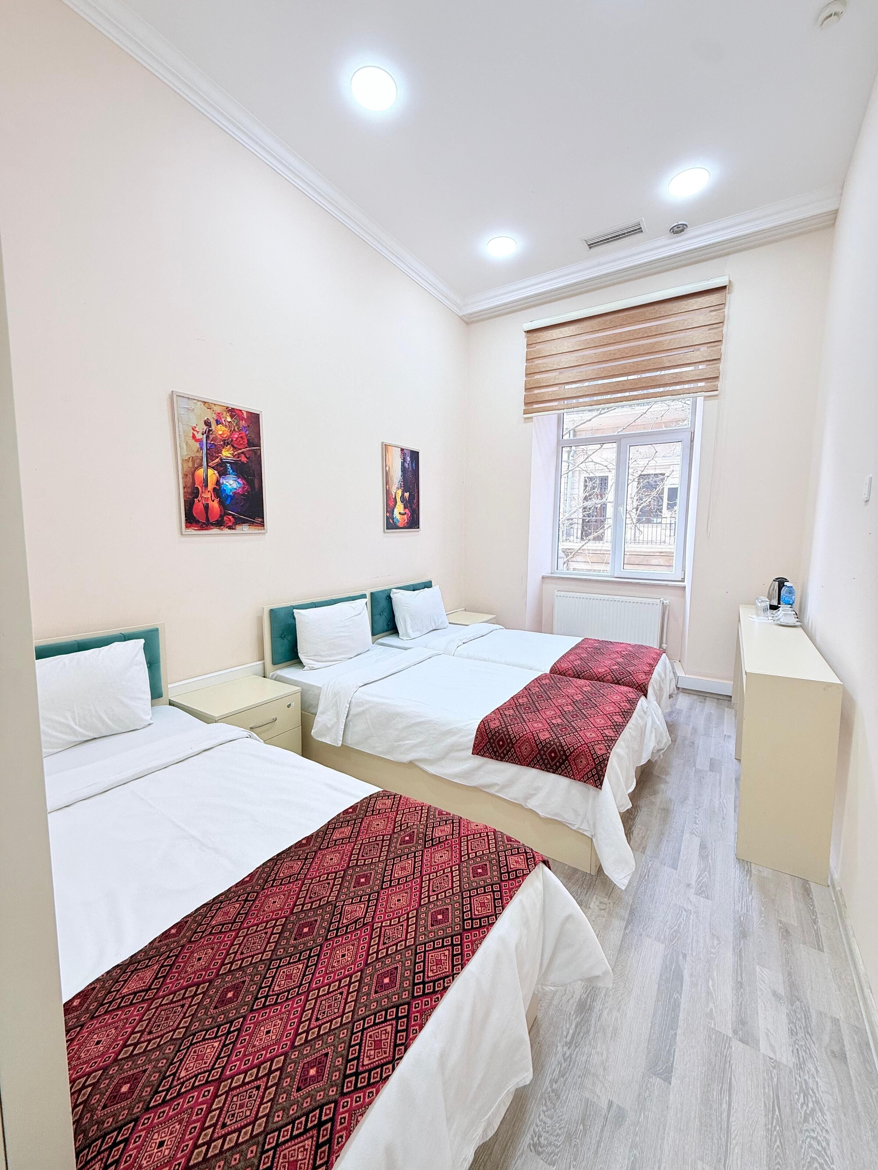 Standard Triple Room | Iron/ironing board, free WiFi