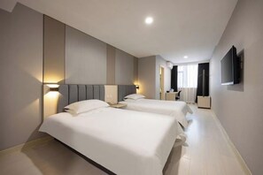 A hotel room with two beds, a TV mounted on the wall, and a bedside table with a lamp. - Jinzhou Star Hotel (Jinzhou Luoyang Road) (Jinzhou)