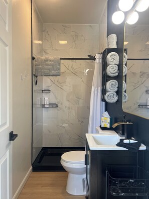 Shower, hair dryer, towels, soap