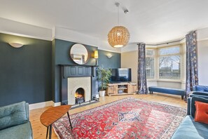 Smart TV, fireplace, books