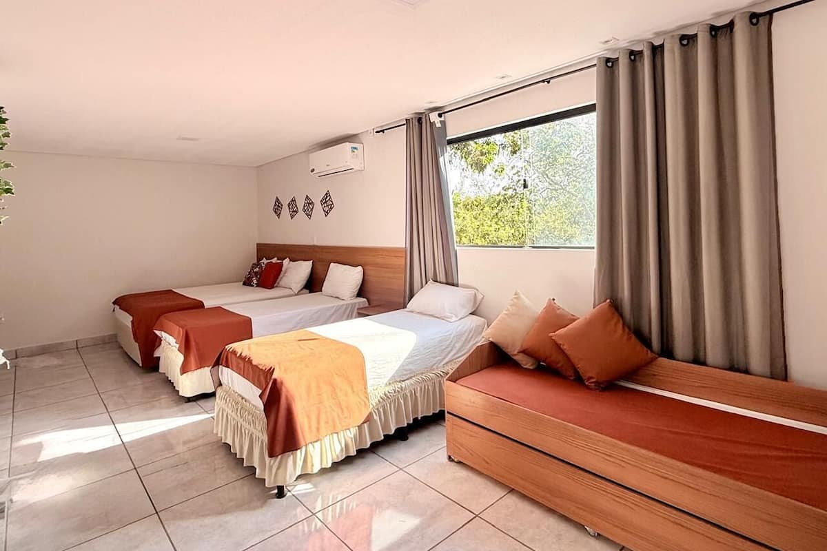 Family Room | Desk, laptop workspace, bed sheets