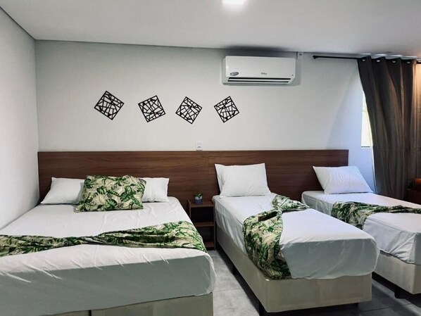 Desk, laptop workspace, bed sheets