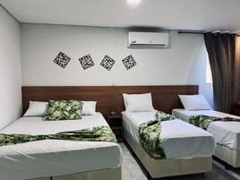 Family Room | Desk, laptop workspace, bed sheets