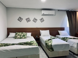 Family Room | Desk, laptop workspace, bed sheets