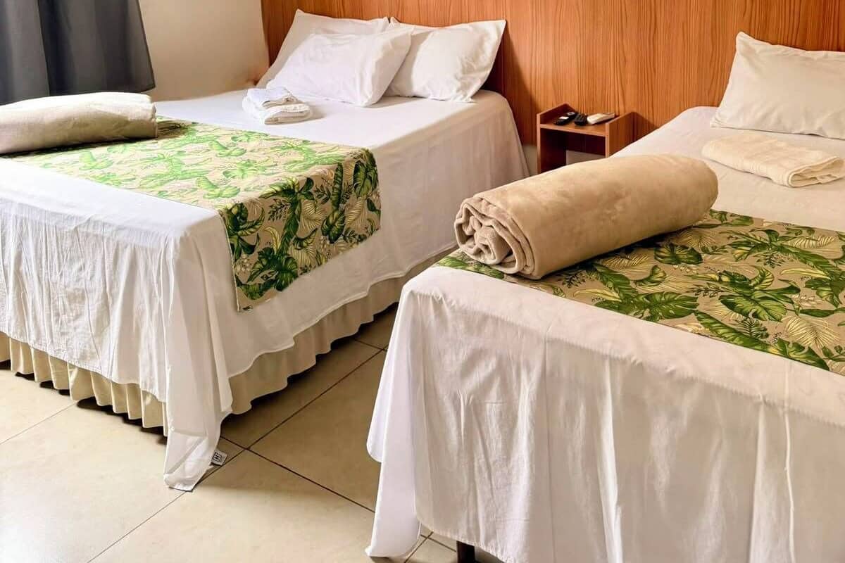 Family Room | Desk, laptop workspace, bed sheets