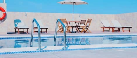 Outdoor pool, pool umbrellas, sun loungers