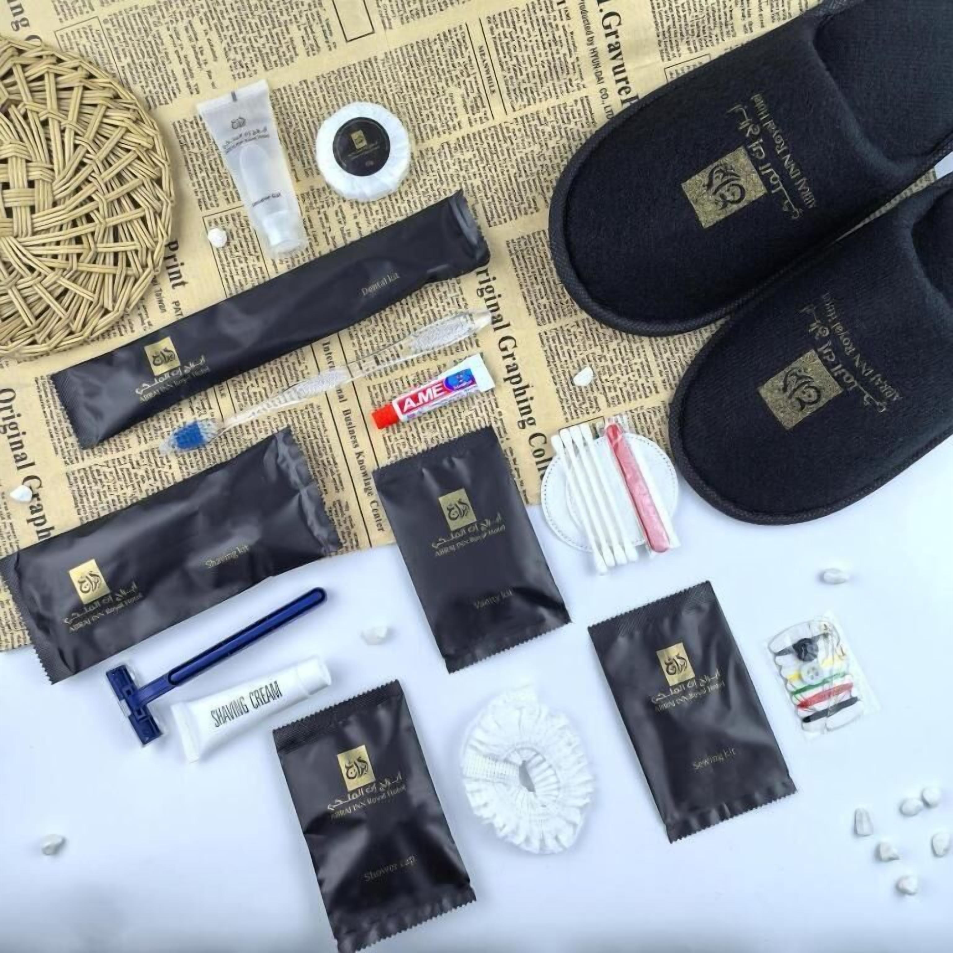 A collection of toiletries and a pair of slippers on a newspaper background.