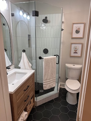 Shower, hair dryer, towels, soap
