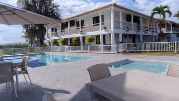 2 outdoor pools, open 9:00 AM to 9:00 PM, free cabanas, pool umbrellas