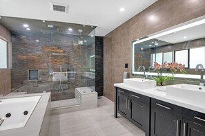 Shower, jetted tub, towels, toilet paper