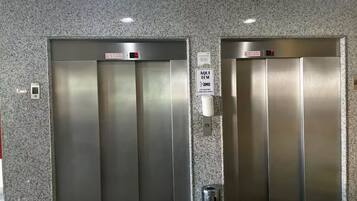 Basic Apartment, Lanai, City View | Living area | 32-inch LED TV with cable channels