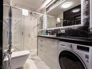 Shower, hair dryer, towels, soap