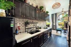 Fridge, electric kettle, dining tables