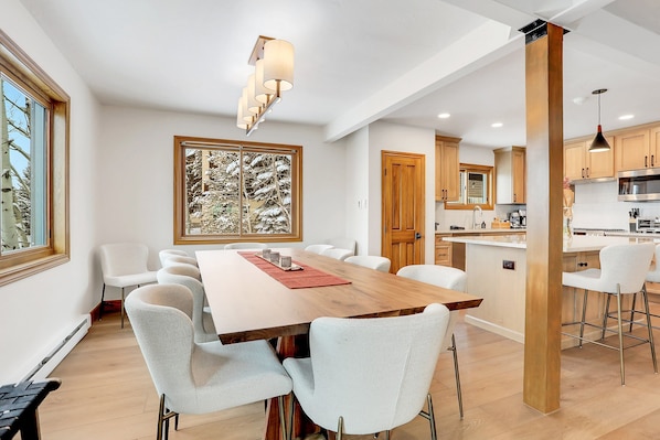 Enjoy meals in this stylish dining area with a large table and comfortable seating for all.
