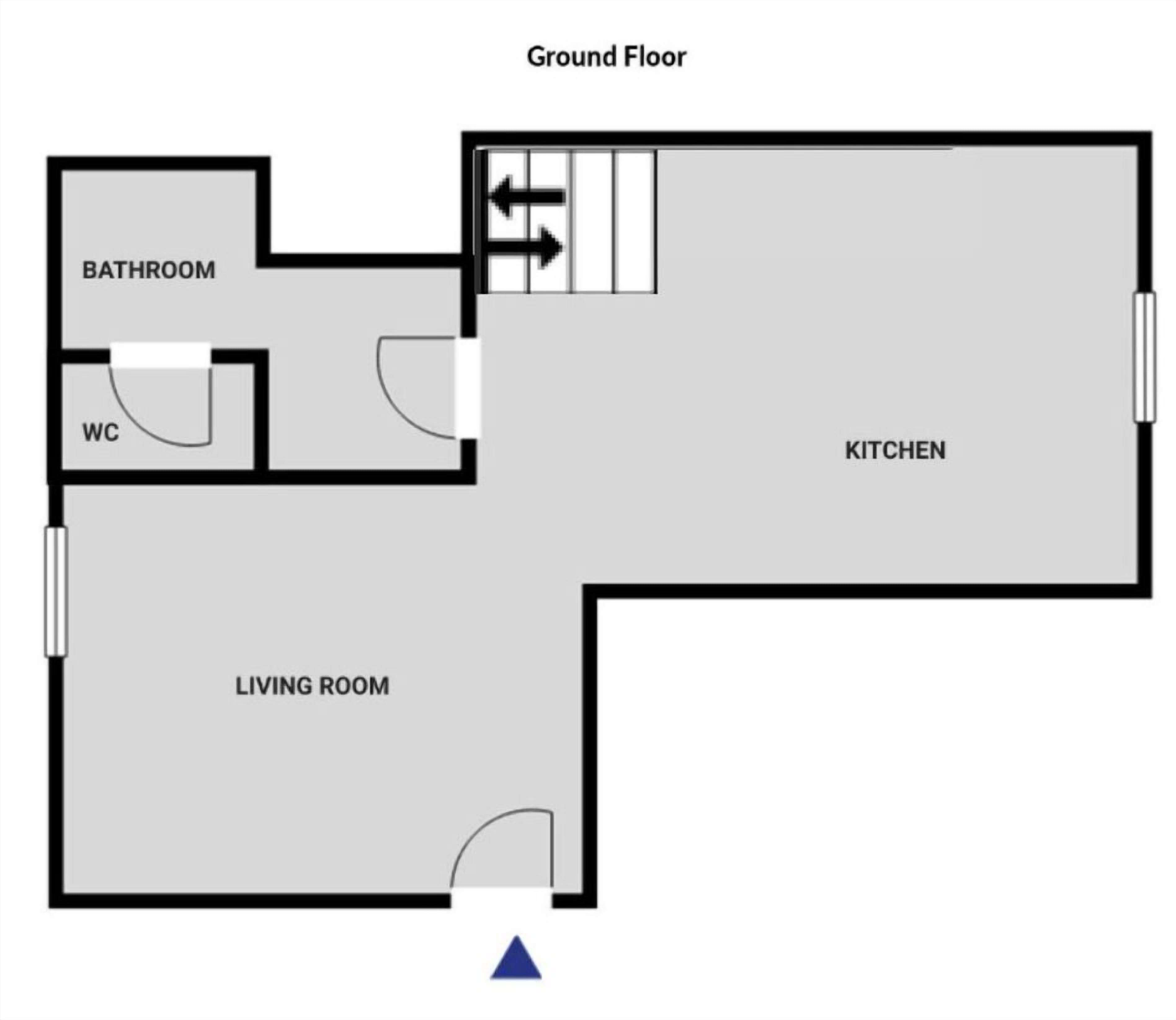 Un appartement situé au rez-de-chaussée, comprenant un salon, une cuisine et une salle de bain.