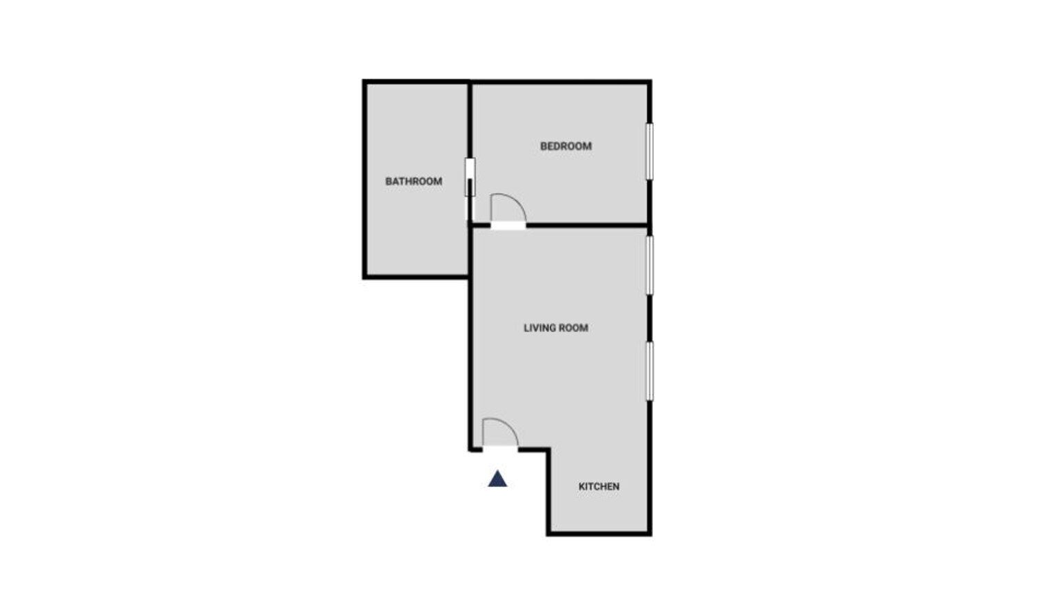 A floor plan with a bathroom, bedroom, living room, and kitchen.