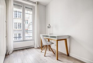 Guests can work at the desk with a view of the adjacent building.