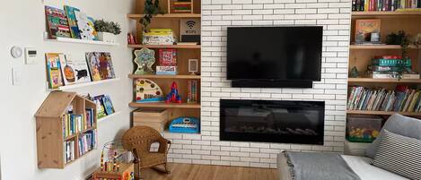 Smart TV, fireplace, books