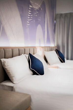 A hotel room with a large bed, two pillows, a headboard, and a wall-mounted artwork. - rakuyado-hanazonoekmae (Osaka)