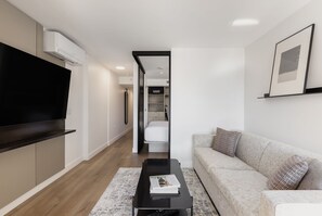 One Bedroom Apartment | Living area | 50-inch Smart TV with cable channels, streaming services - Keefer House (Vancouver)