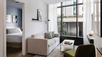 Two Bedroom Apartment | Living area | 50-inch Smart TV with cable channels, streaming services