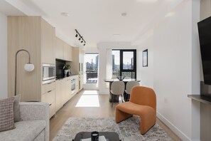 Deluxe Two Bedroom Apartment | Private kitchen | Full-sized fridge, microwave, oven, stovetop