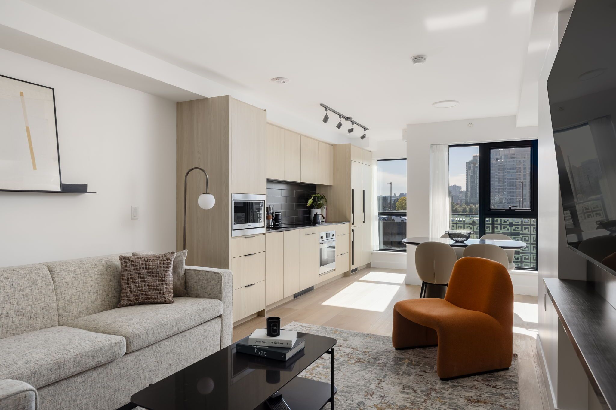 Deluxe Two Bedroom Apartment | Living area | 50-inch Smart TV with cable channels, streaming services