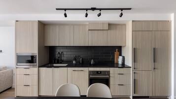 Three Bedroom Apartment | Private kitchen | Full-sized fridge, microwave, oven, stovetop