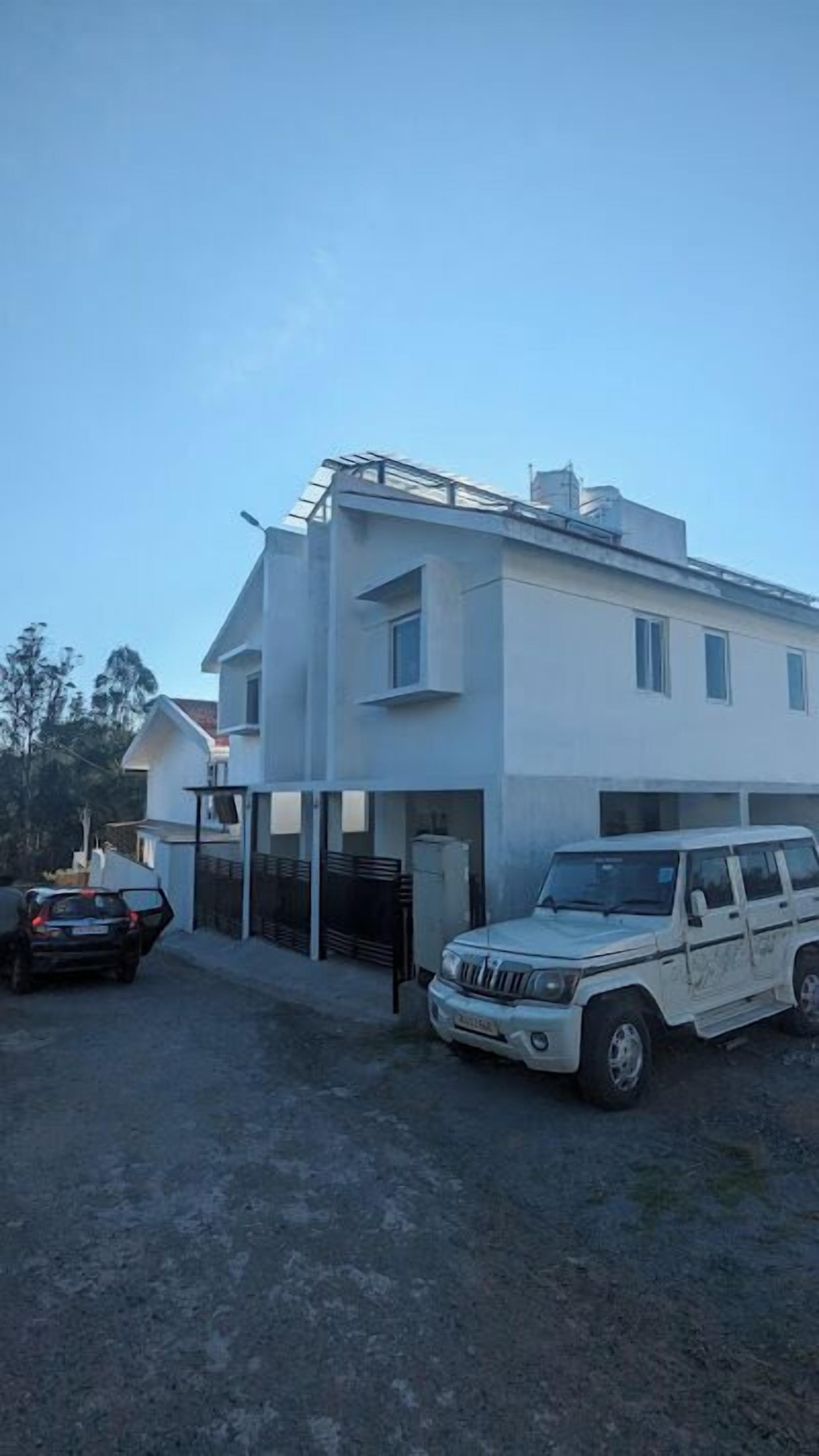 A modern two-story building with a garage.