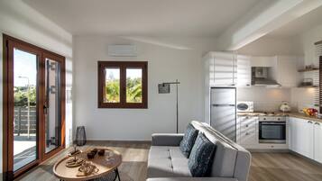 Superior Villa, Sea View | Living area | Flat-screen TV