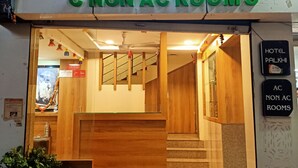 A hotel entrance with a sign reading "HOTEL PALKHI C NON AC ROOM'S". - Hotel Palkhi (Rahata)