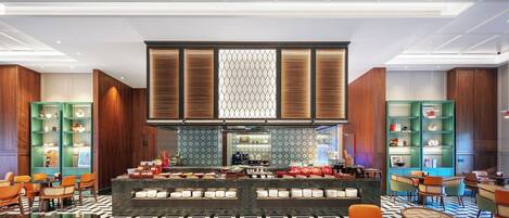 Eine moderne Hotelhalle mit einer zentralen Rezeption, einer Sitzecke und dekorativen Wandverkleidungen.