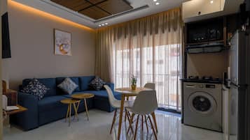 Comfort Double Room, Courtyard View | Living area | 50-inch Smart TV with cable channels, Netflix, pay films