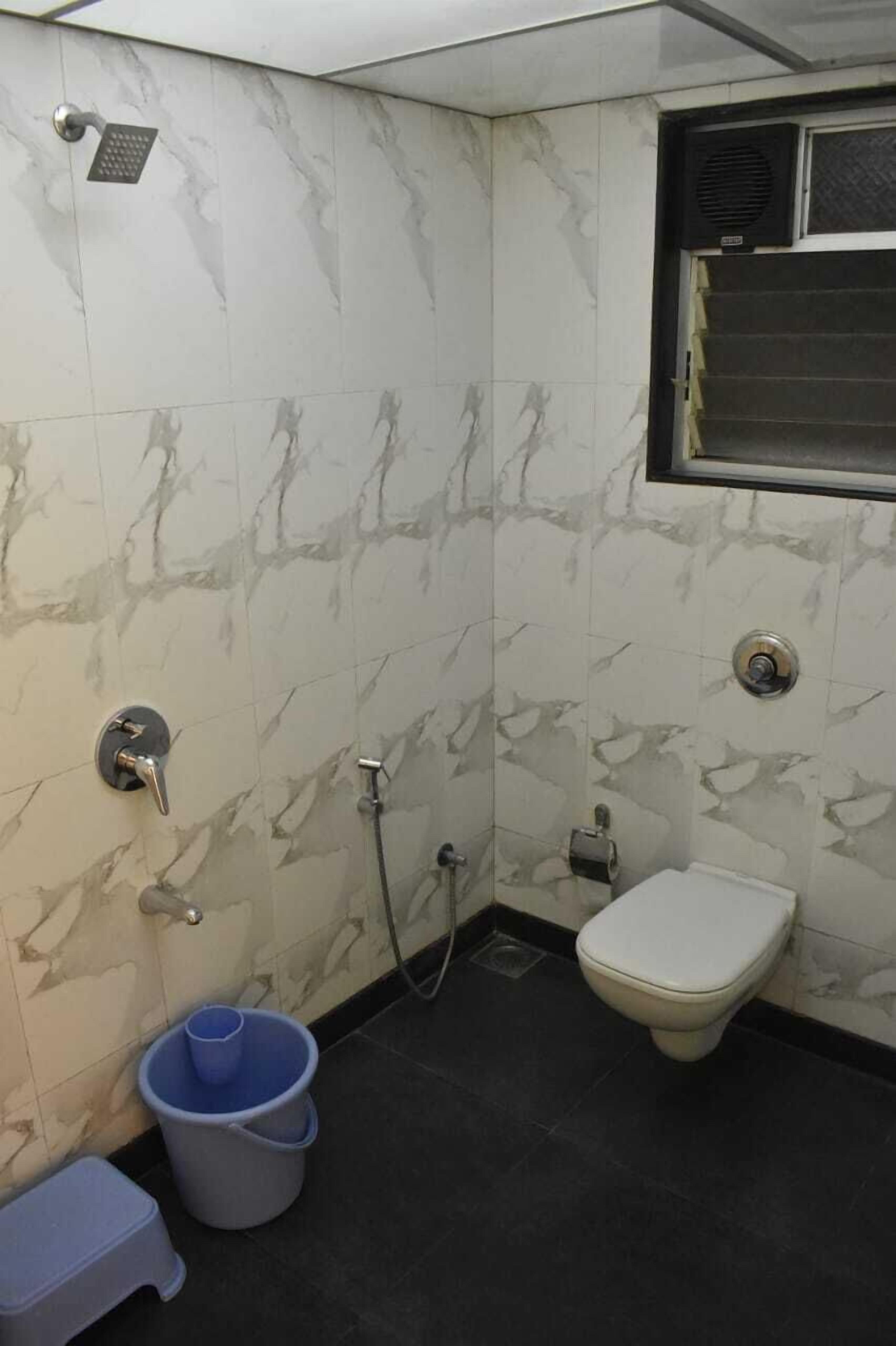 Shower, bathrobes, slippers, towels