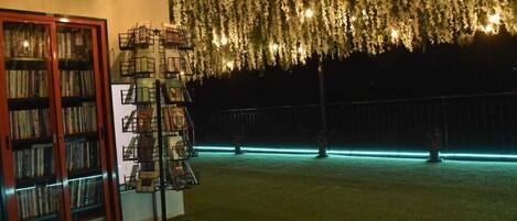 A library with bookshelves and a ladder.