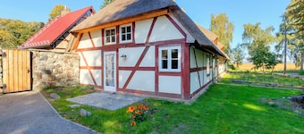 House in the middle of the garden by the swan pond