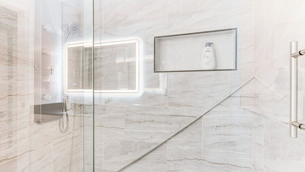 A modern bathroom with a glass shower enclosure, marble tiles, and a framed shelf with toiletries. - 6 Mi to Spectrum Center: Spacious Getaway w/ Deck (Charlotte)